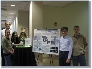 Dr. Stack with young STEM scholars (photograph)