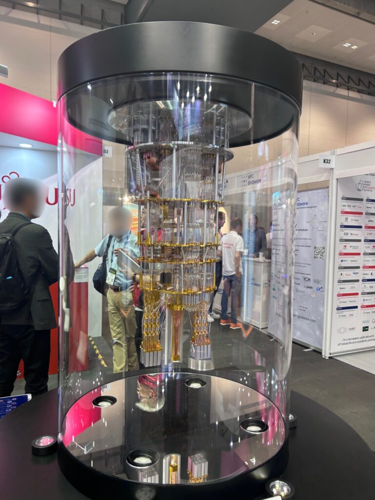 Conceptual mock-up of the "quantum chandelier"; the cryogenic system used to cool and control superconducting quantum processors, as displayed at the Fujitsu booth at ISC26.